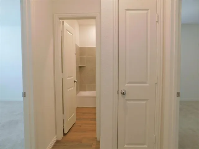 a bathroom with a glass door shower