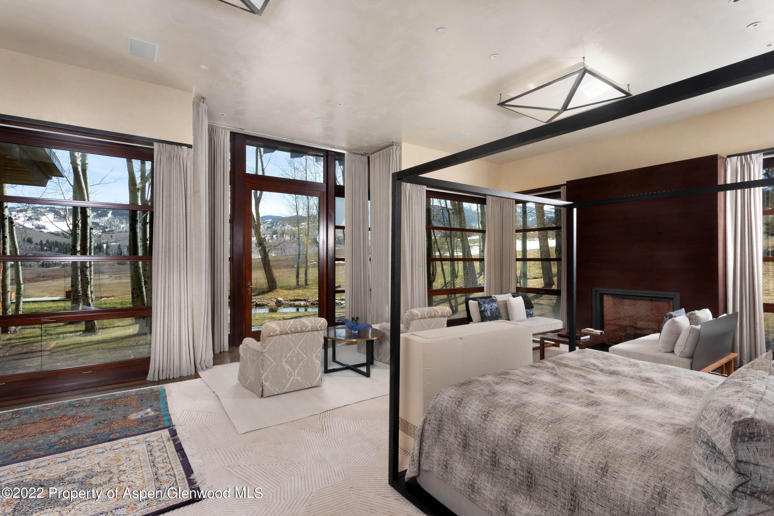 600 Owl Creek Ranch Road Aspen, CO 81611 - Photo 11 of 84 a large bedroom with large window and a large window