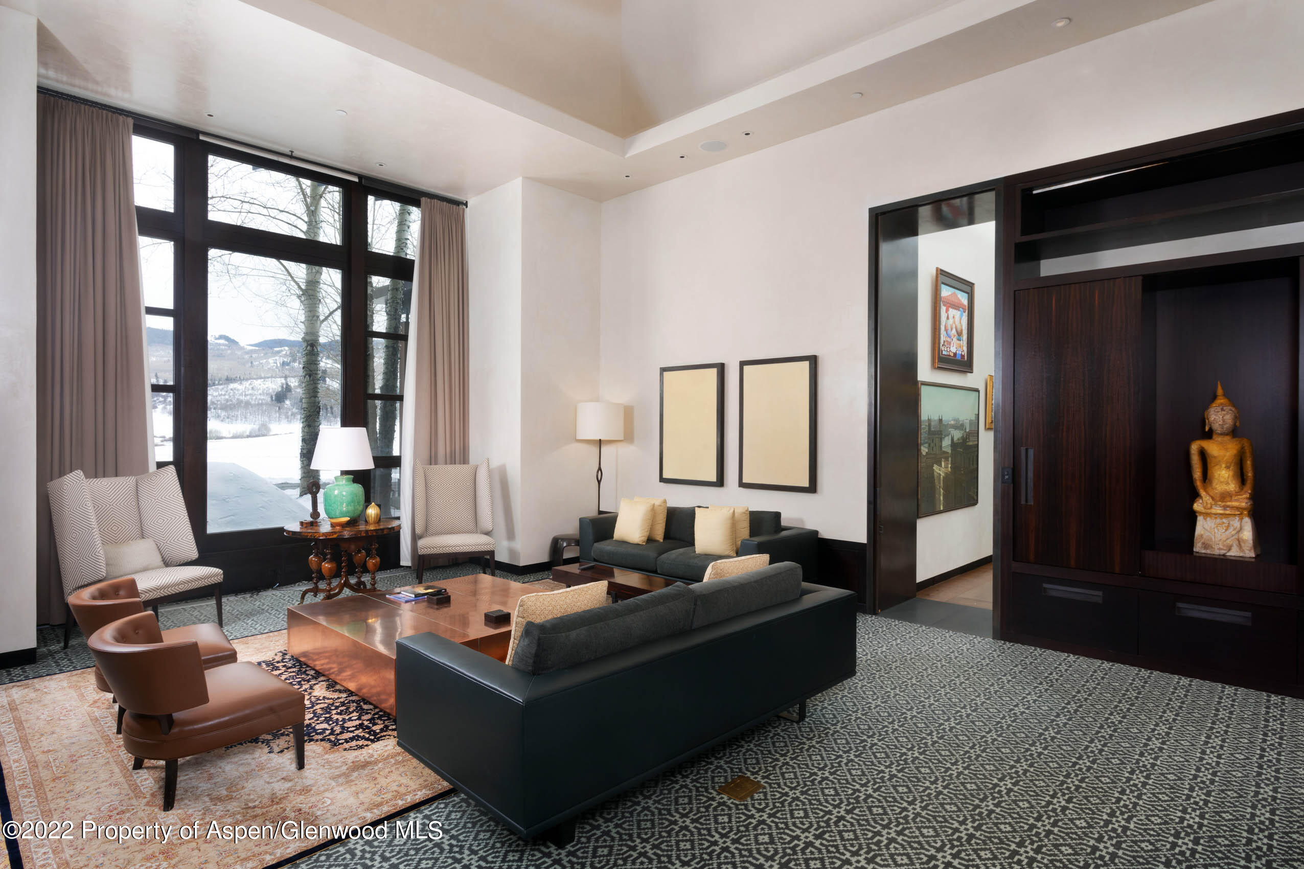 600 Owl Creek Ranch Road Aspen, CO 81611 - Photo 24 of 84 a living room with furniture and large windows