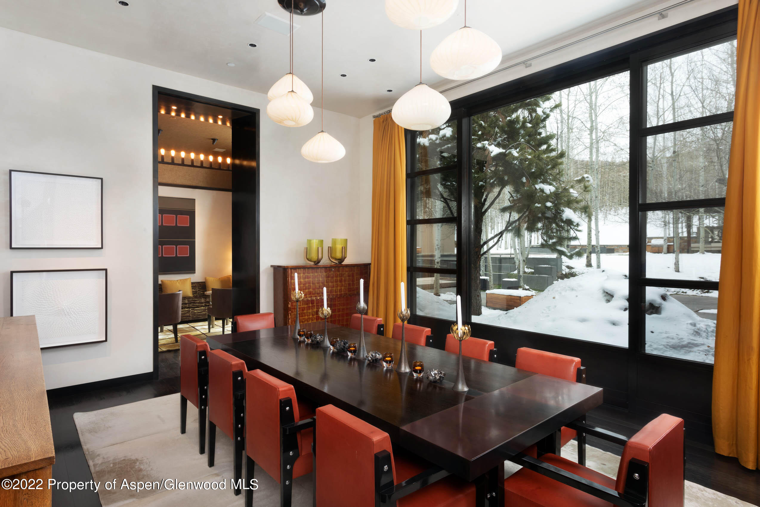 600 Owl Creek Ranch Road Aspen, CO 81611 - Photo 38 of 84 a view of a dining room with furniture window and wooden floor
