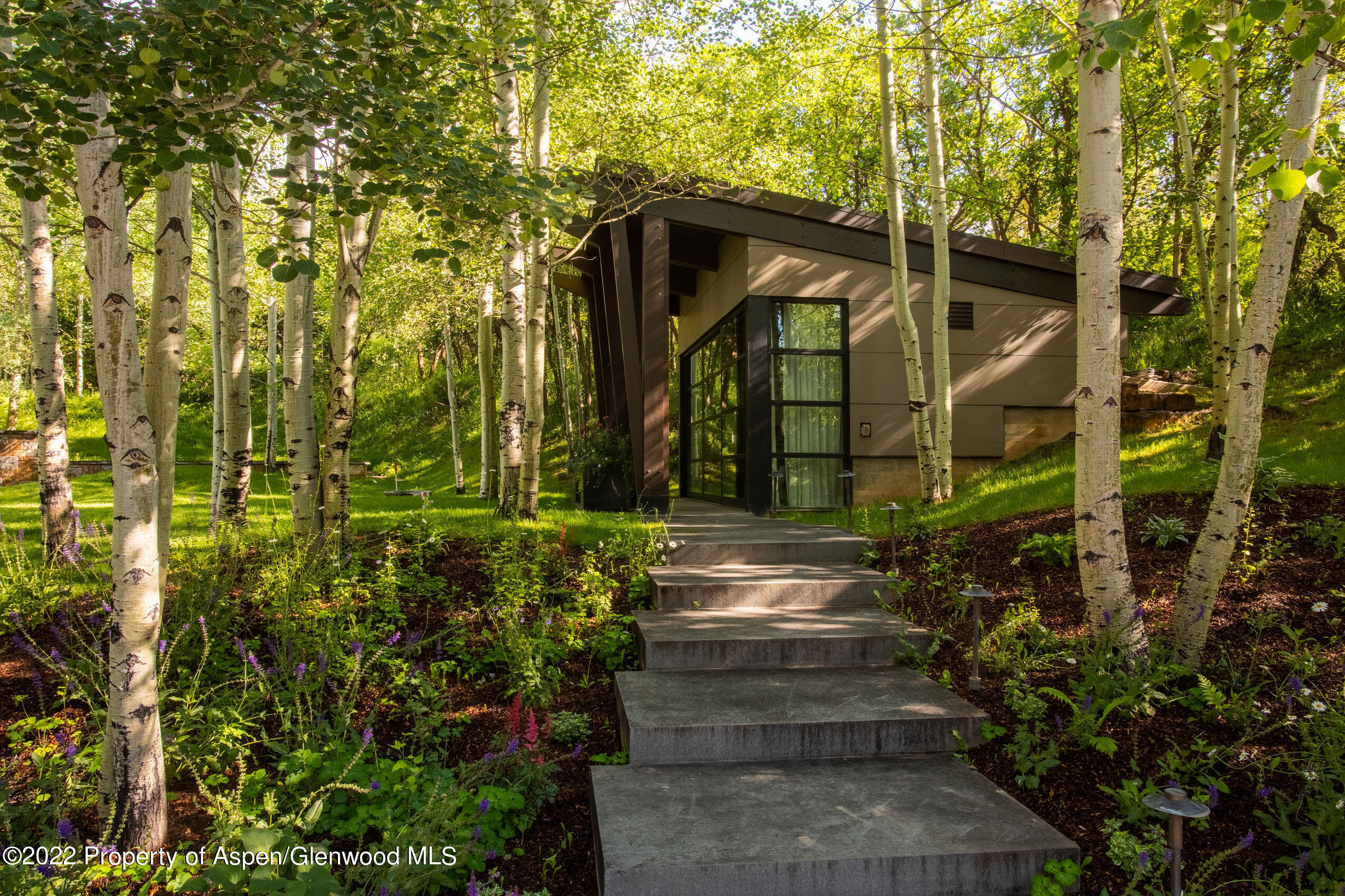 600 Owl Creek Ranch Road Aspen, CO 81611 - Photo 55 of 84 a front view of a house with a yard