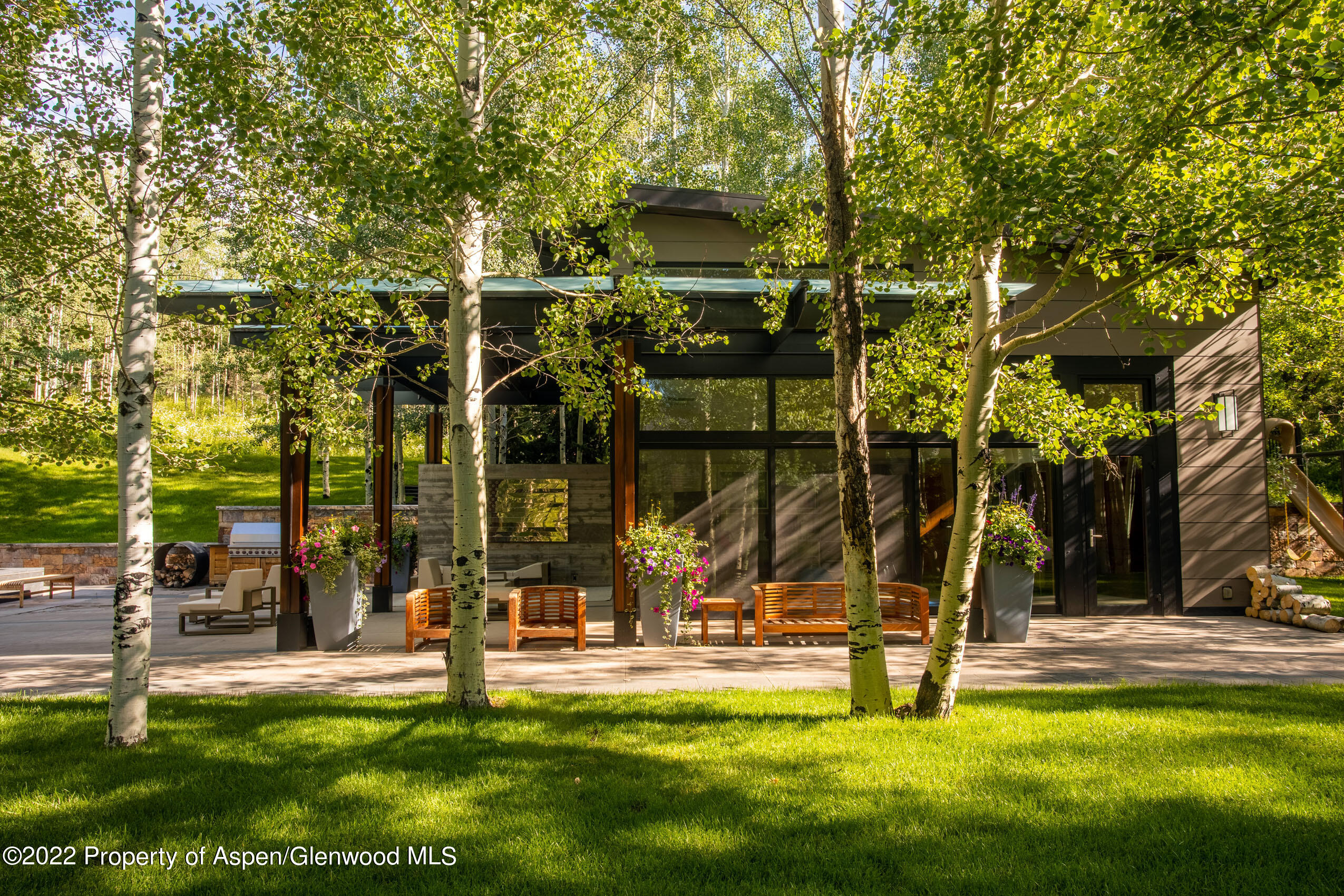600 Owl Creek Ranch Road Aspen, CO 81611 - Photo 59 of 84 a view of a house with swimming pool and sitting area