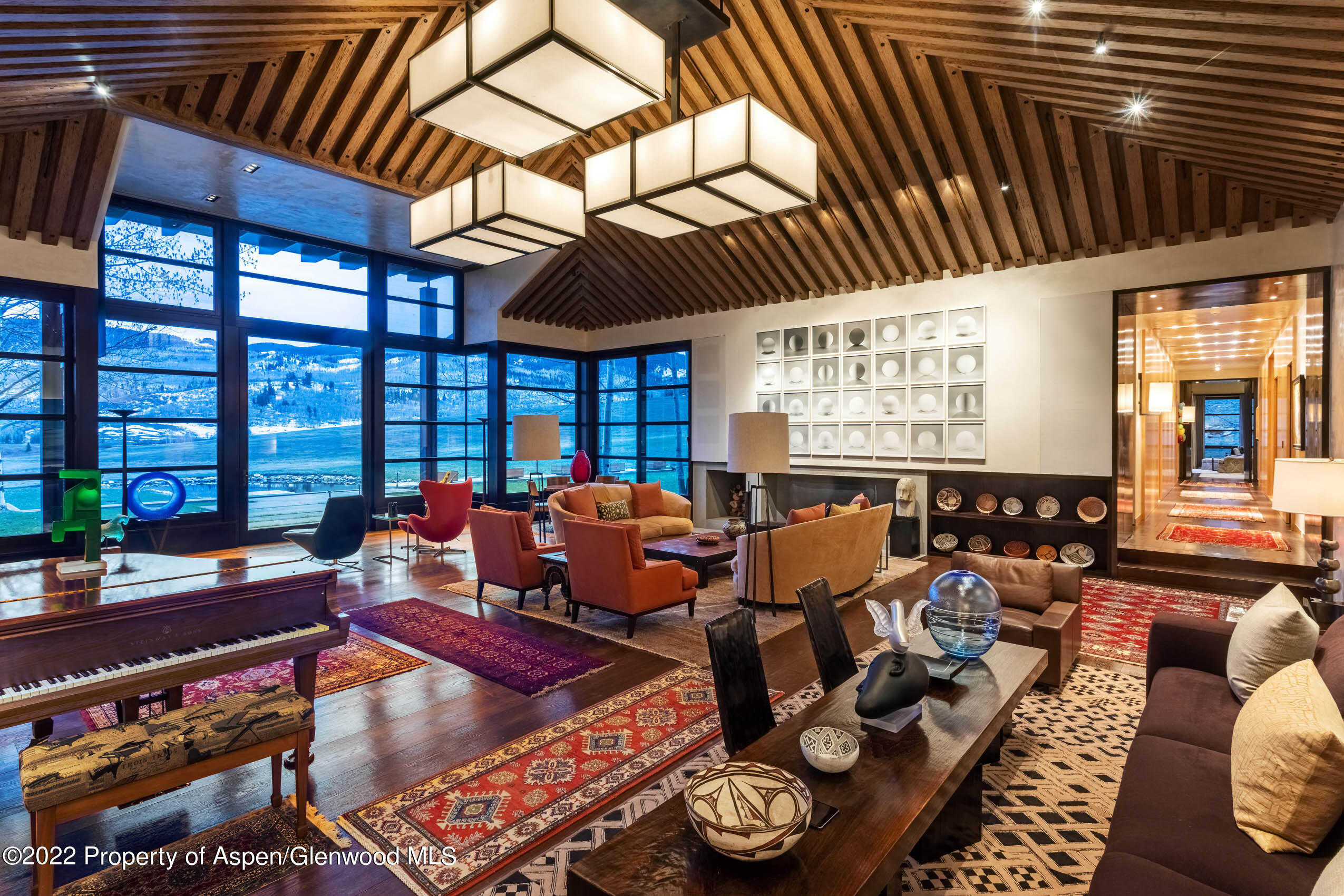 600 Owl Creek Ranch Road Aspen, CO 81611 - Photo 6 of 84 a living room with lots of furniture and a chandelier