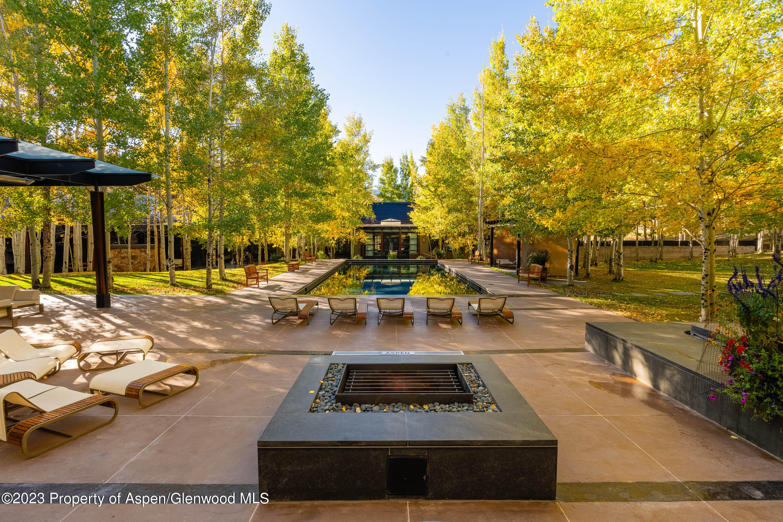 600 Owl Creek Ranch Road Aspen, CO 81611 - Photo 68 of 84 a view of a swimming pool with an outdoor seating