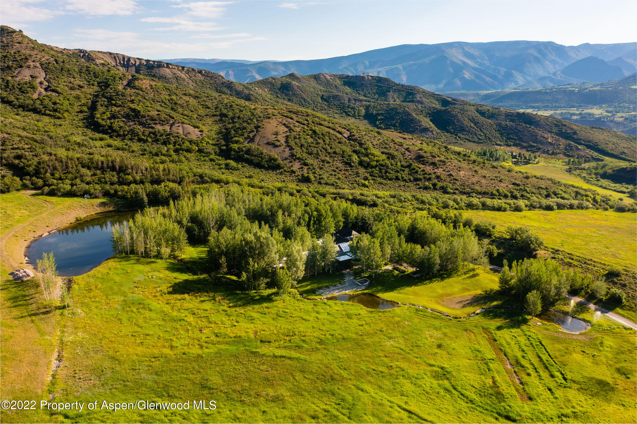 600 Owl Creek Ranch Road Aspen, CO 81611 - Photo 75 of 84 a view of a lake with a mountain