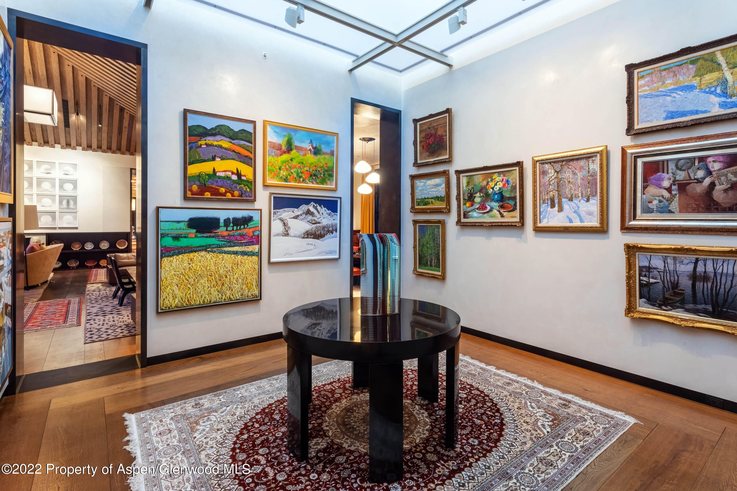 600 Owl Creek Ranch Road Aspen, CO 81611 - Photo 8 of 84 a living room with furniture and a wooden floor