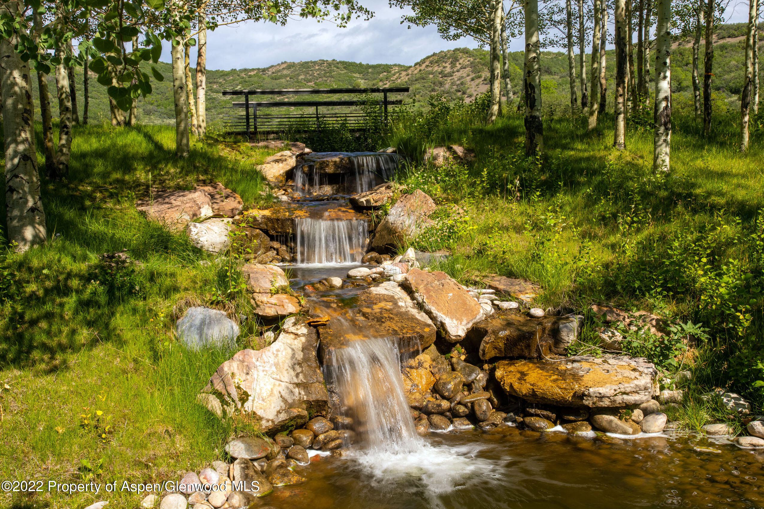 600 Owl Creek Ranch Road Aspen, CO 81611 - Photo 9 of 84 Cascading Waterfall from the upper pond