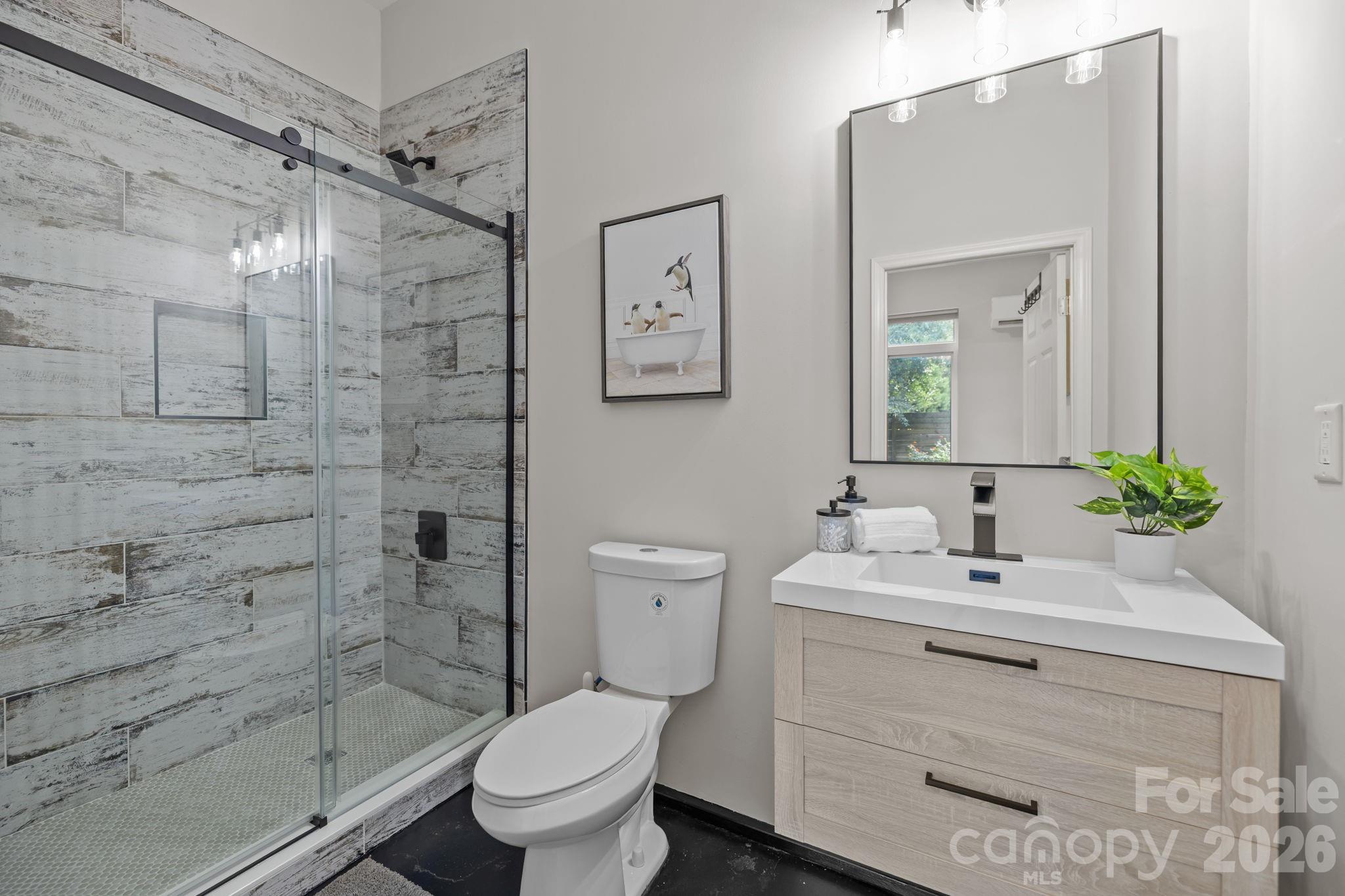 3534 Card Street Charlotte, NC 28205 - Photo 14 of 24 a bathroom with a sink toilet and shower