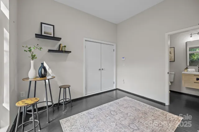 a view of room with furniture and wooden floor