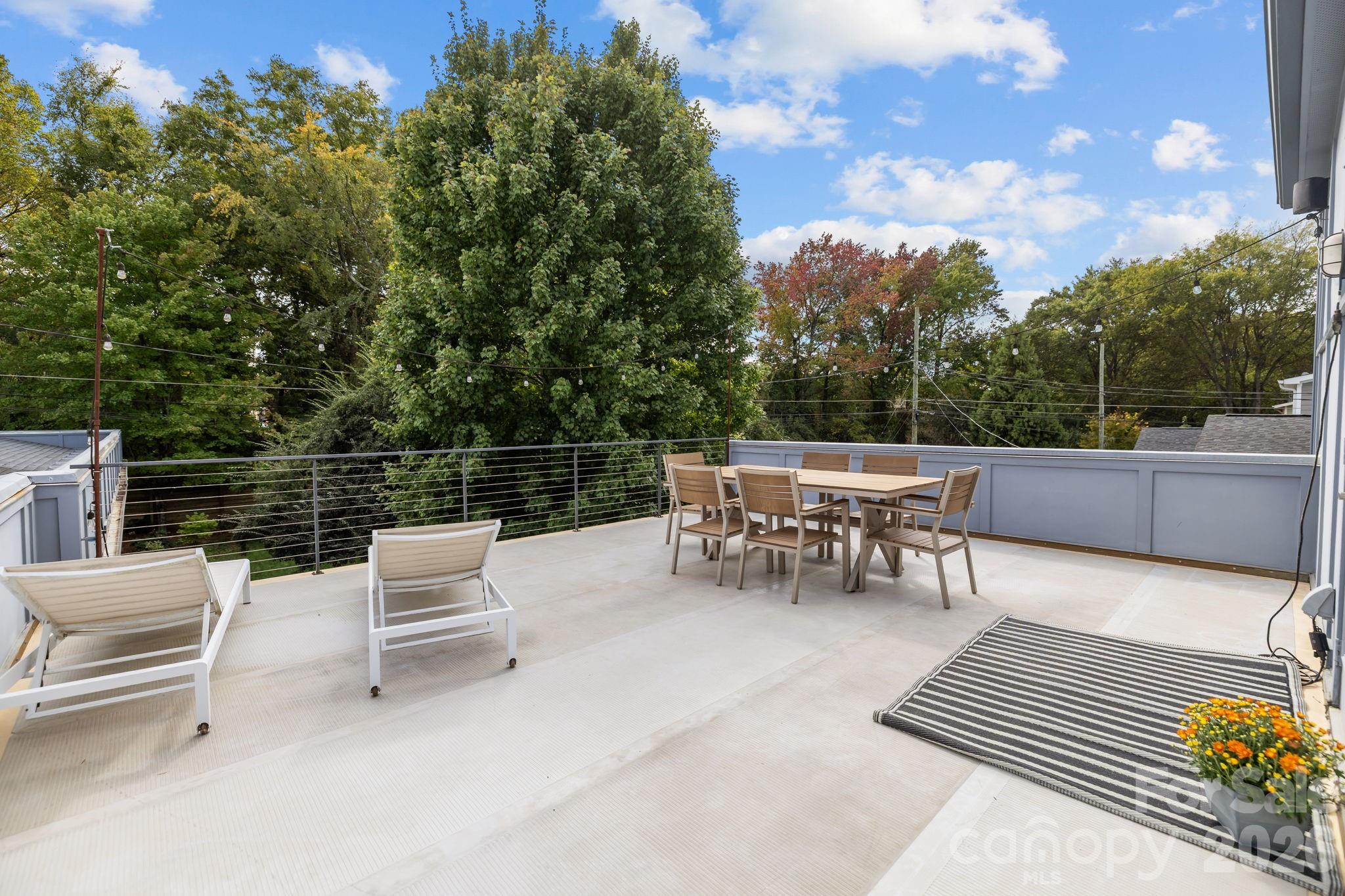 3534 Card Street Charlotte, NC 28205 - Photo 21 of 24 a view of a chairs and tables on the roof deck