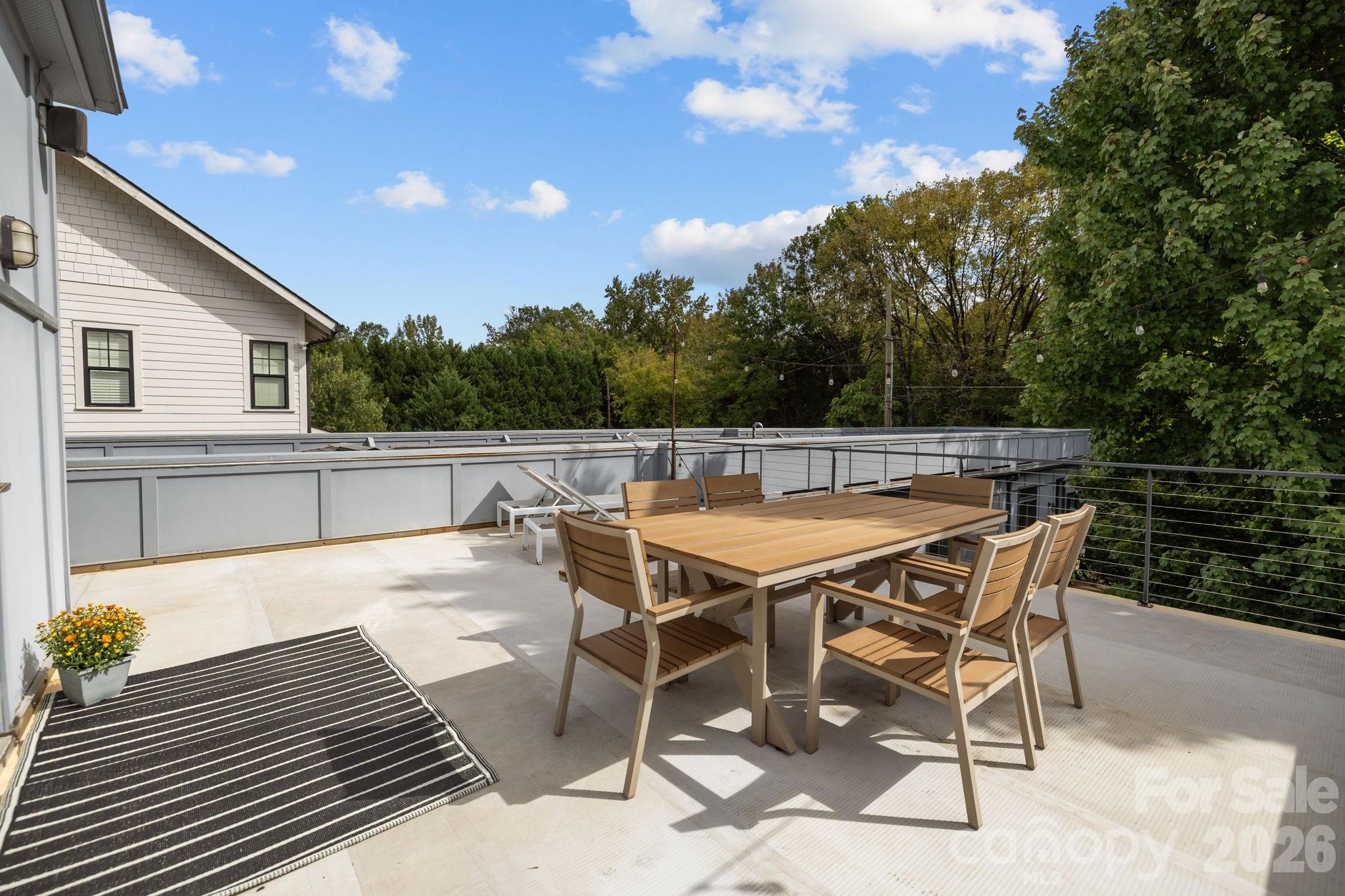 3534 Card Street Charlotte, NC 28205 - Photo 22 of 24 a patio with wooden floor and iron fence