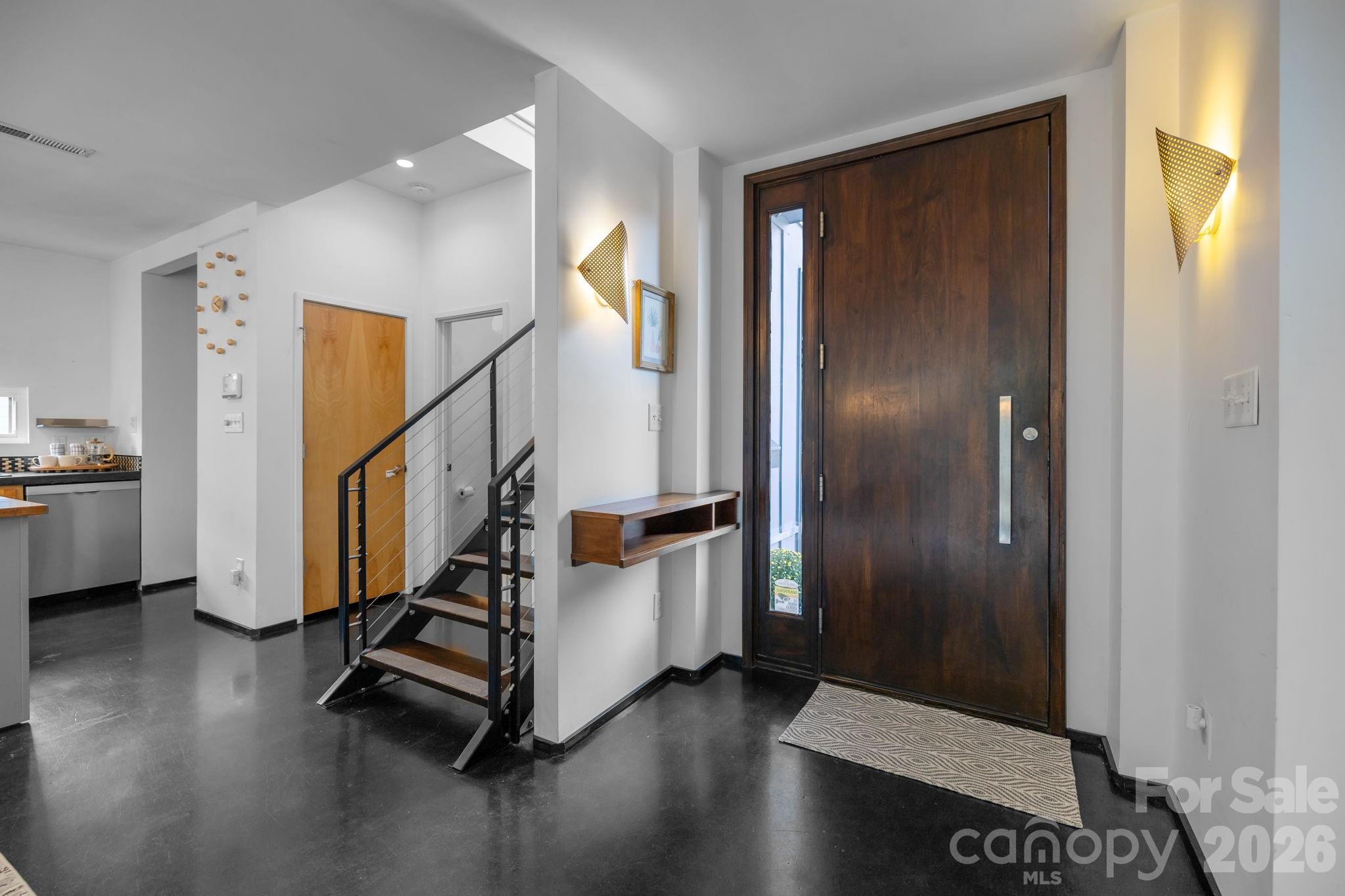 3534 Card Street Charlotte, NC 28205 - Photo 4 of 24 a view of entryway with wooden floor and stairs