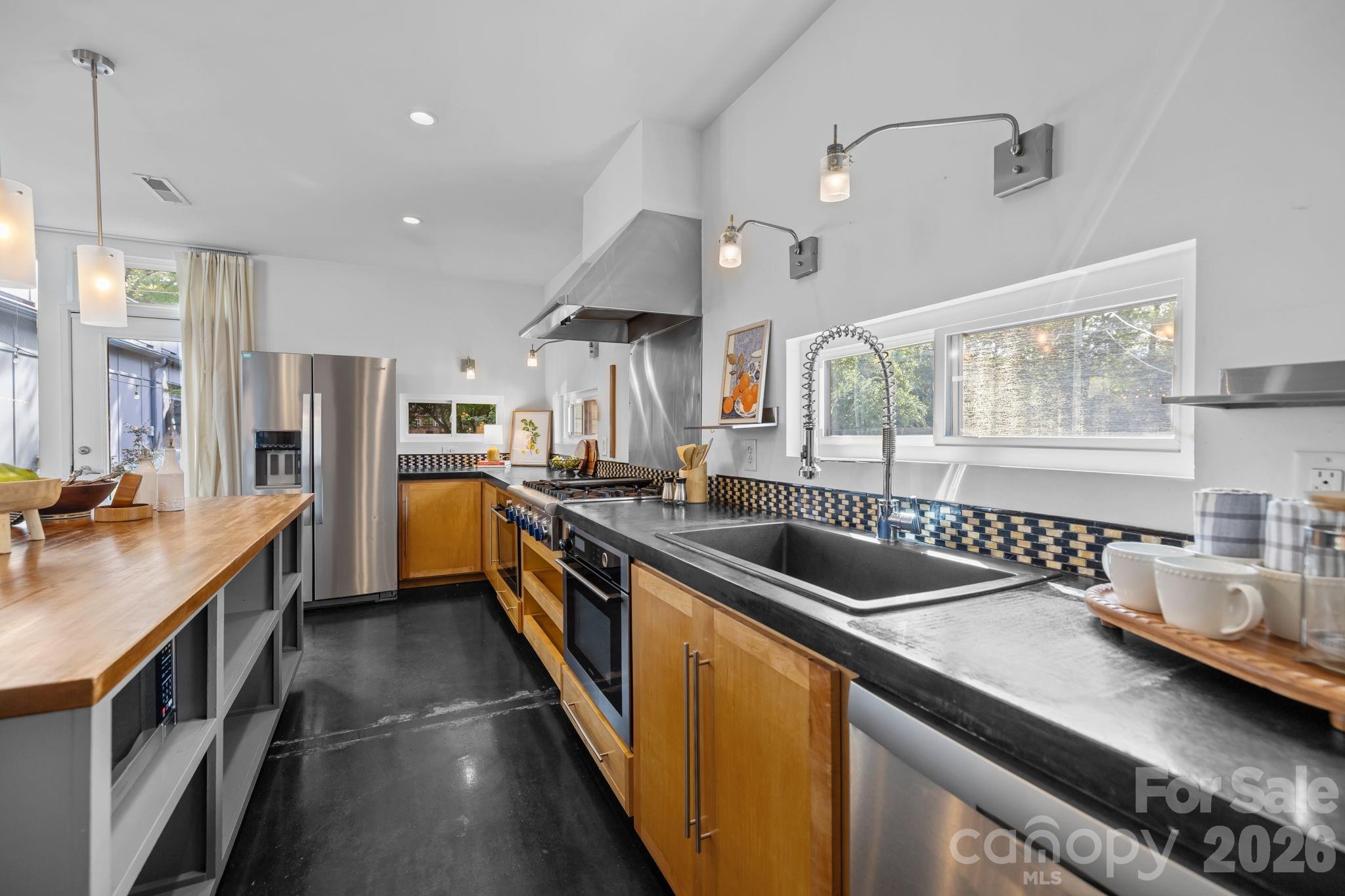 3534 Card Street Charlotte, NC 28205 - Photo 6 of 24 a kitchen with lots of counter space and a sink