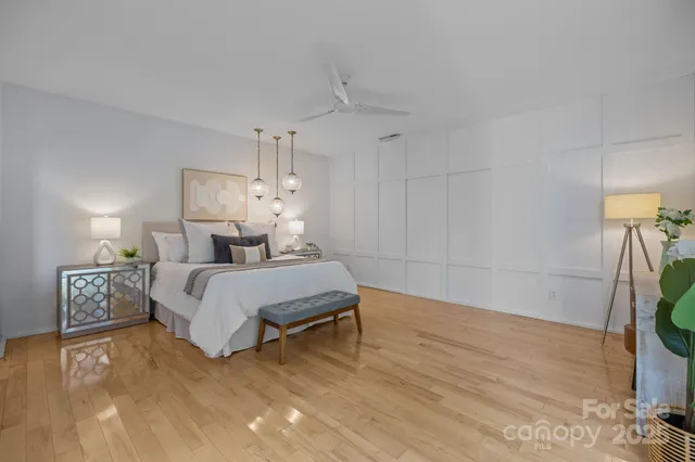 a bedroom with a bed and a rug