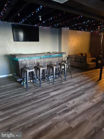 a lobby with furniture and flat screen tv