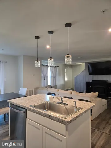 a kitchen with a sink and stove