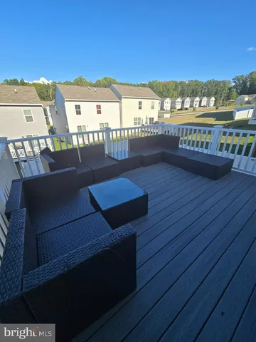 a view of a balcony with wooden floor