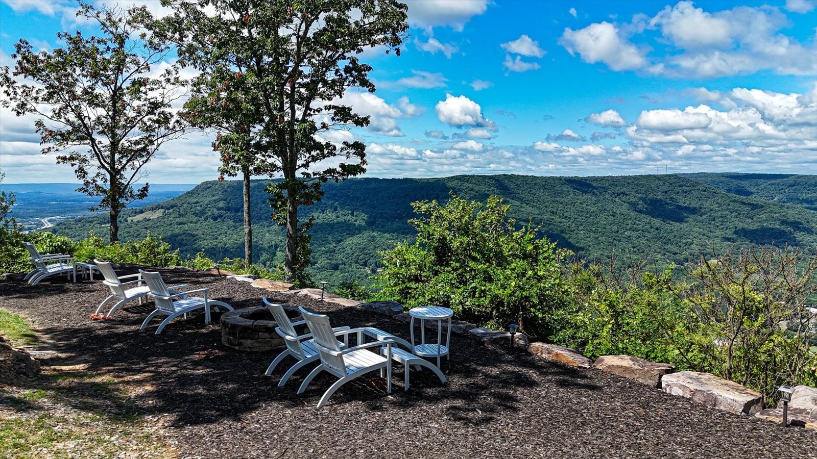 7 A Raulston Fls Road Jasper, TN 37347 - Photo 45 of 66 a view of a backyard with table and chairs and a large tree