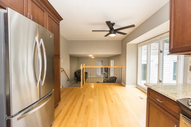 a spacious bathroom with a granite countertop sink and a large mirror