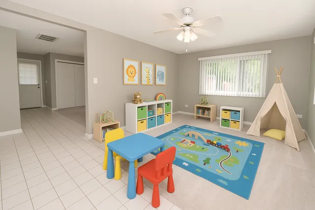 a living room filled with furniture and a table