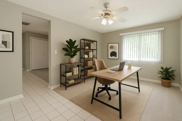 a view of a workspace with furniture
