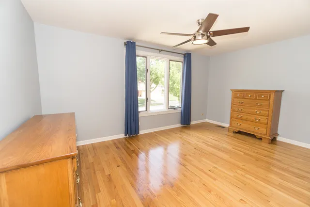 a front view of a house with a yard outdoor seating and barbeque oven