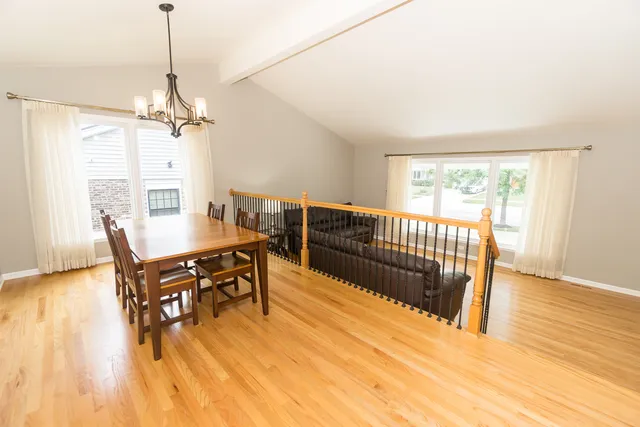 a large kitchen with a large window and stainless steel appliances