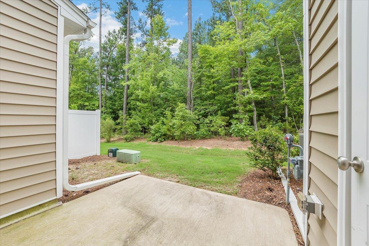 203 Zante Currant Road Durham, NC 27703 - Photo 22 of 28 As been stated before, private back area. No watching your neighbors cook dinner. Its just you and the trees. Back Patio