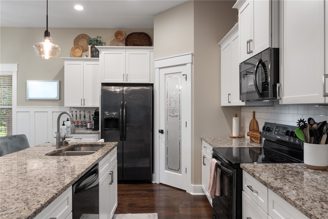 201 Hearthstone Drive Anderson, SC 29621 - Photo 18 of 49 Culinary delights await in this modern kitchen with granite countertops and rich wood flooring.