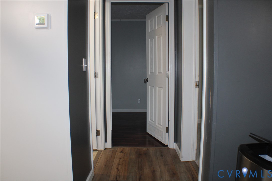 1811 Halls Store Road Mineral, VA 23117 - Photo 17 of 39 Hallway featuring dark wood-style floors and baseb