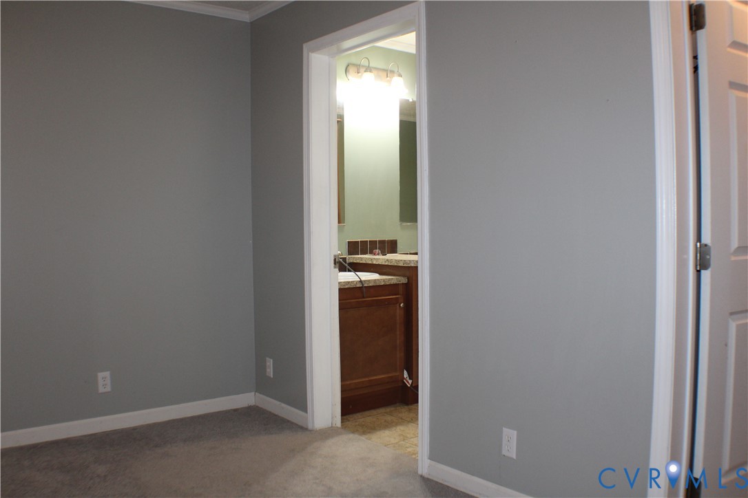1811 Halls Store Road Mineral, VA 23117 - Photo 26 of 39 Unfurnished bedroom with light colored carpet, ens