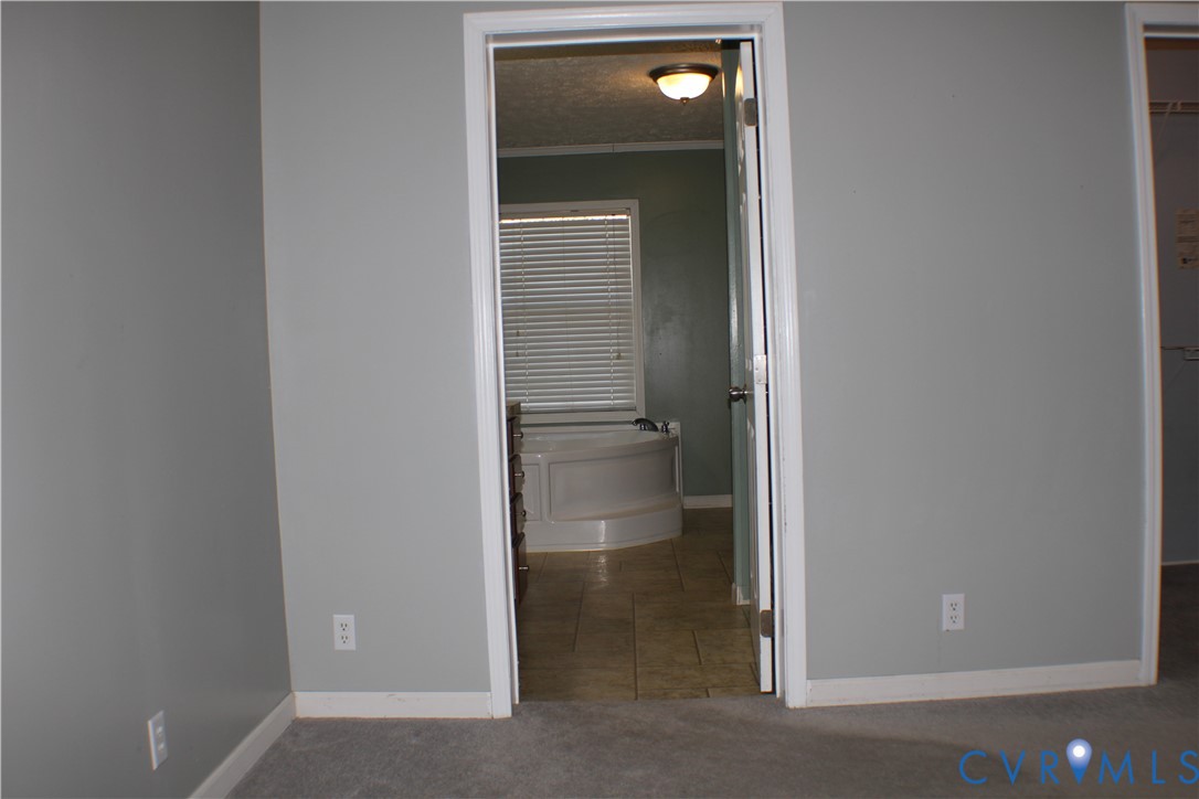 1811 Halls Store Road Mineral, VA 23117 - Photo 27 of 39 Unfurnished bedroom featuring a walk in closet, en