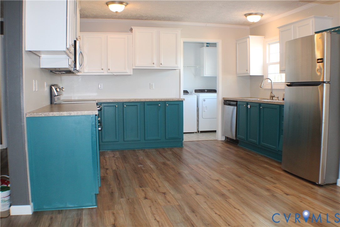 1811 Halls Store Road Mineral, VA 23117 - Photo 33 of 39 Kitchen with blue cabinets, appliances with stainl