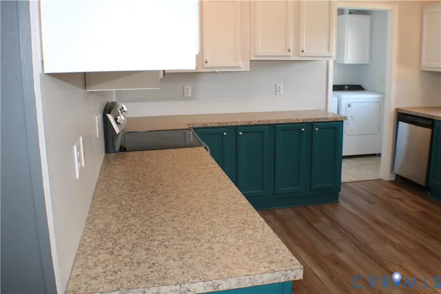 a kitchen with a refrigerator and a sink