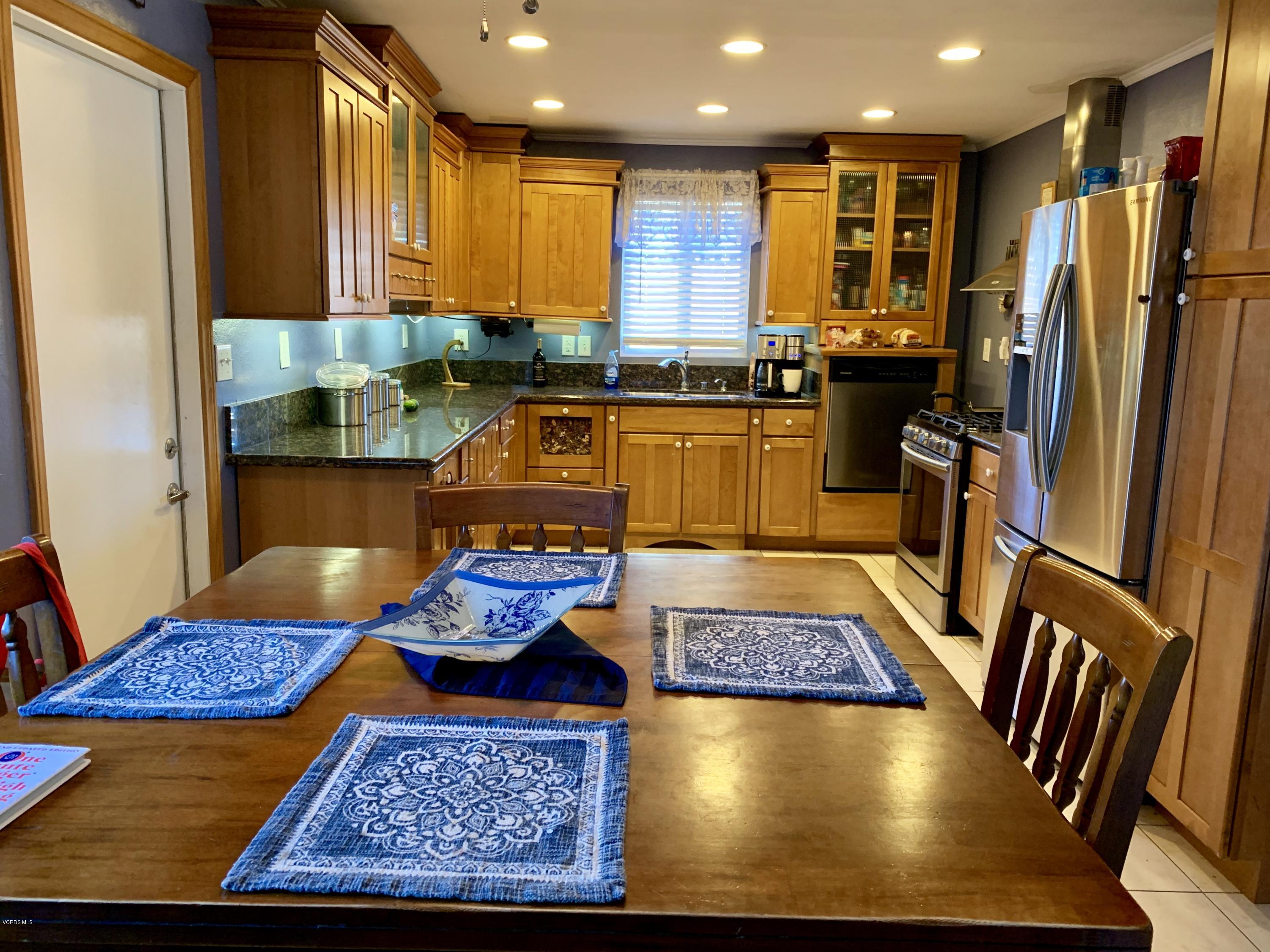 2890 Fitzgerald Road Simi Valley, CA 93065 - Photo 12 of 40 a view of kitchen with stainless steel appliances granite countertop sink stove and refrigerator