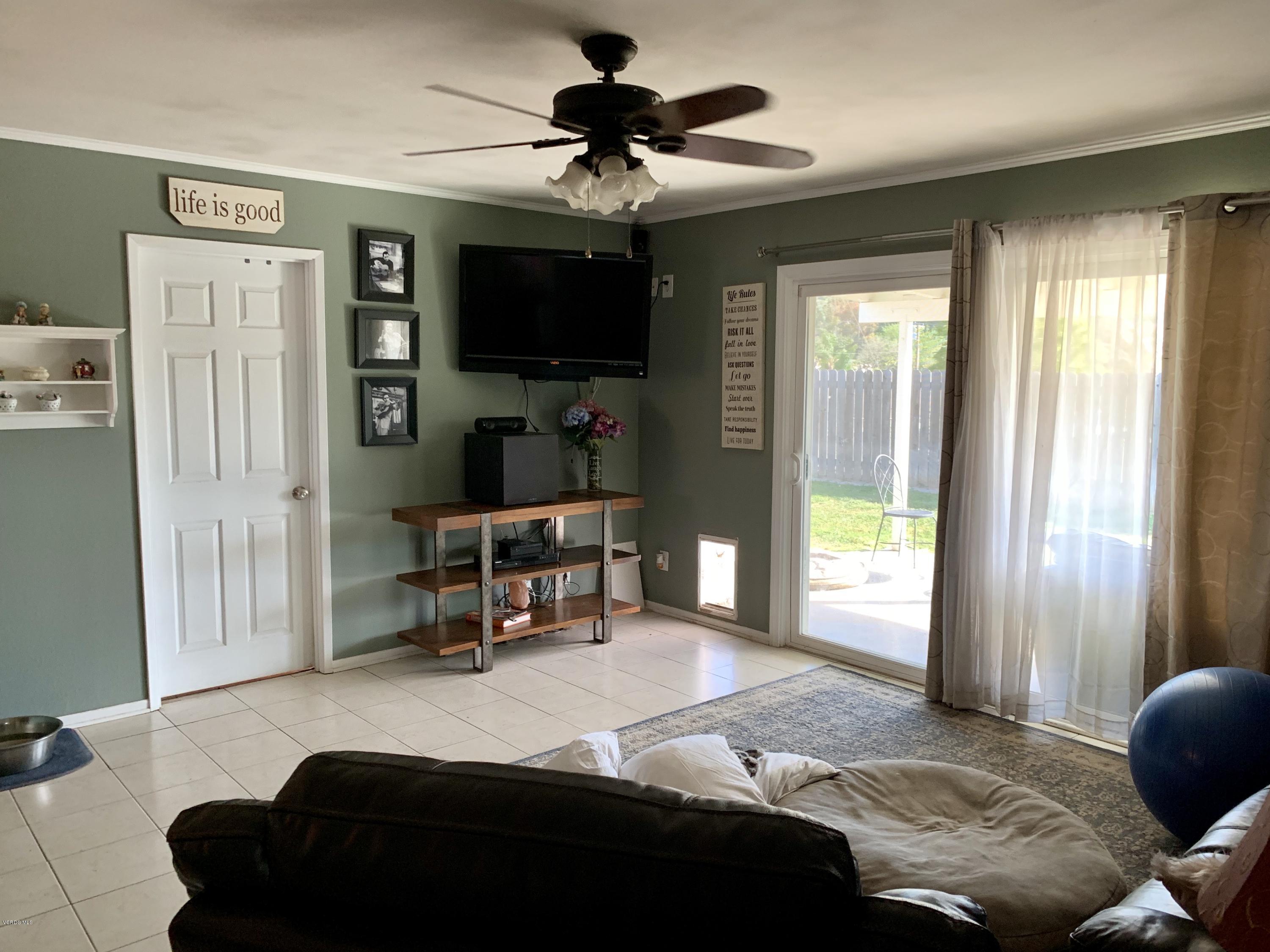 2890 Fitzgerald Road Simi Valley, CA 93065 - Photo 15 of 40 a living room with furniture and a flat screen tv