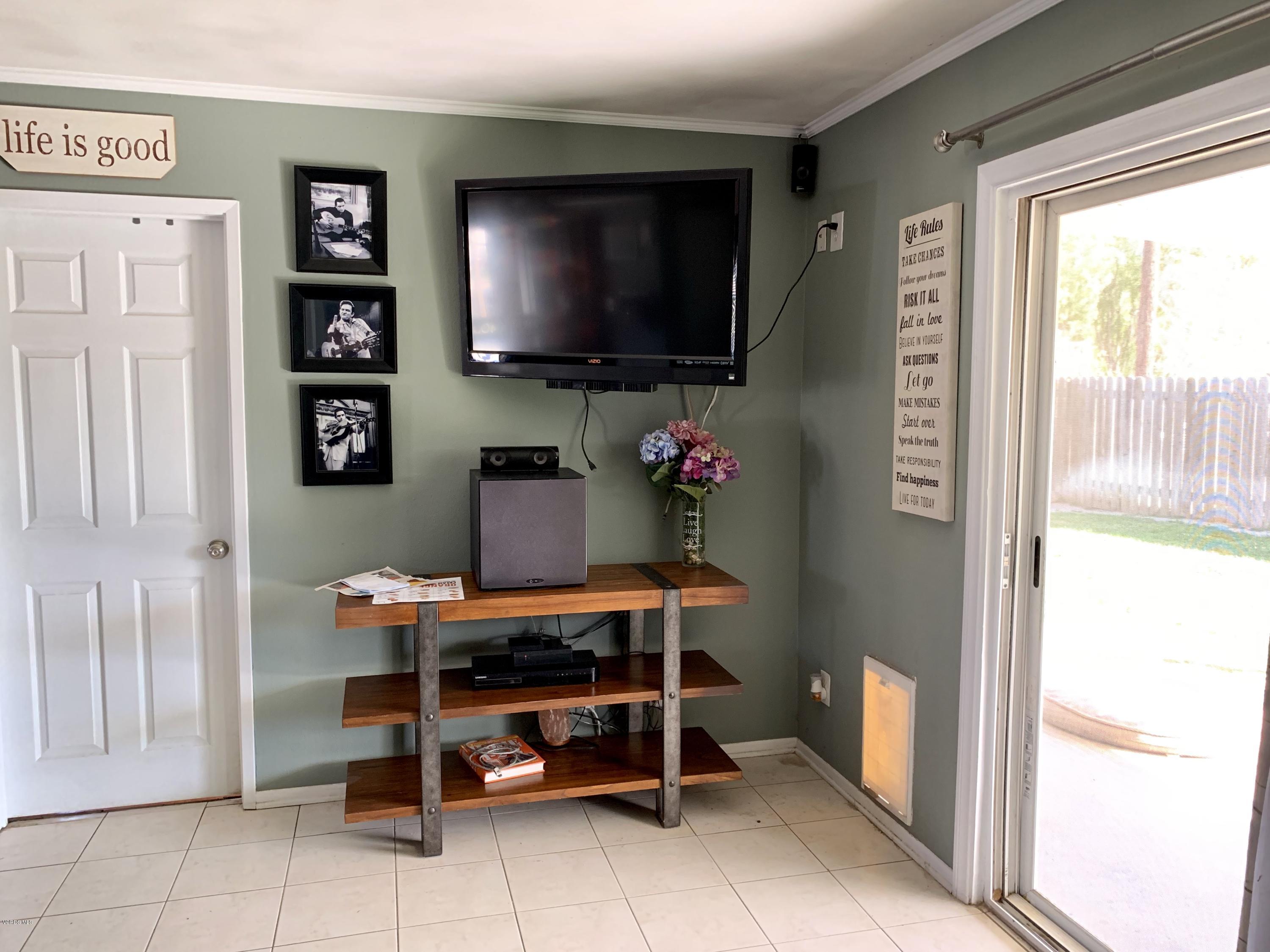 2890 Fitzgerald Road Simi Valley, CA 93065 - Photo 18 of 40 a room with furniture a flat screen tv and a window