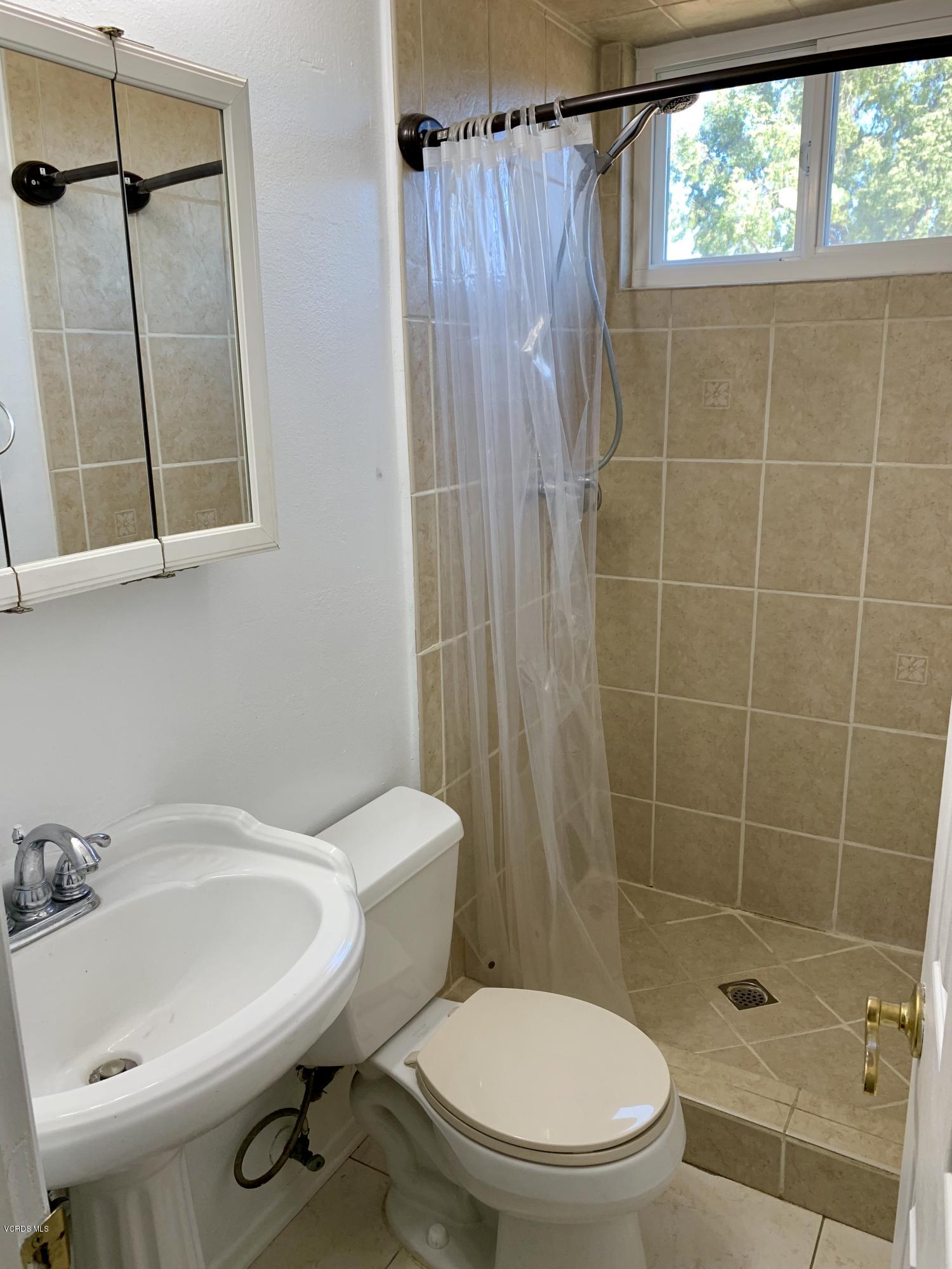 2890 Fitzgerald Road Simi Valley, CA 93065 - Photo 20 of 40 a bathroom with a sink a toilet and shower