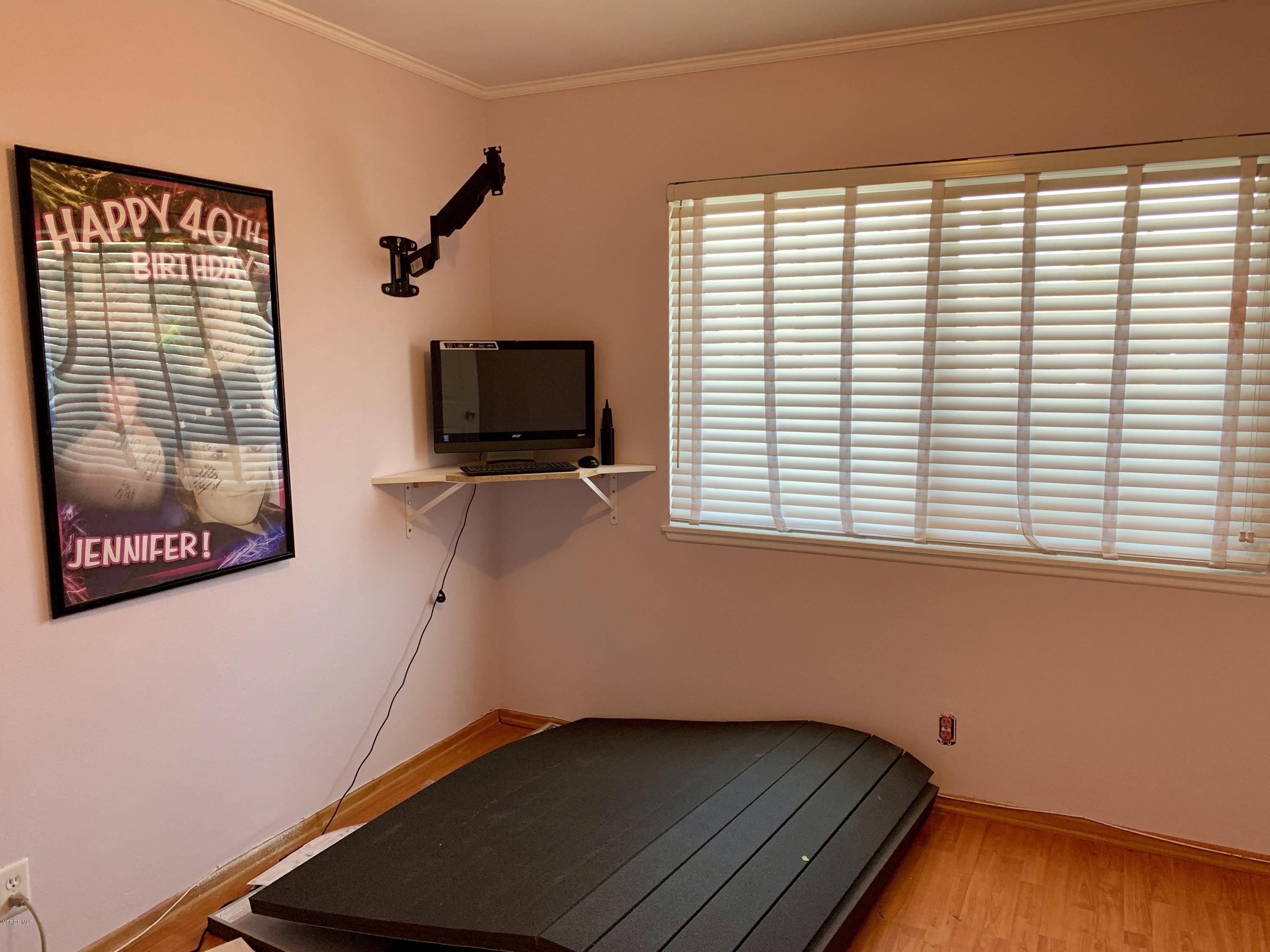 2890 Fitzgerald Road Simi Valley, CA 93065 - Photo 21 of 40 a room with window and a flat screen tv