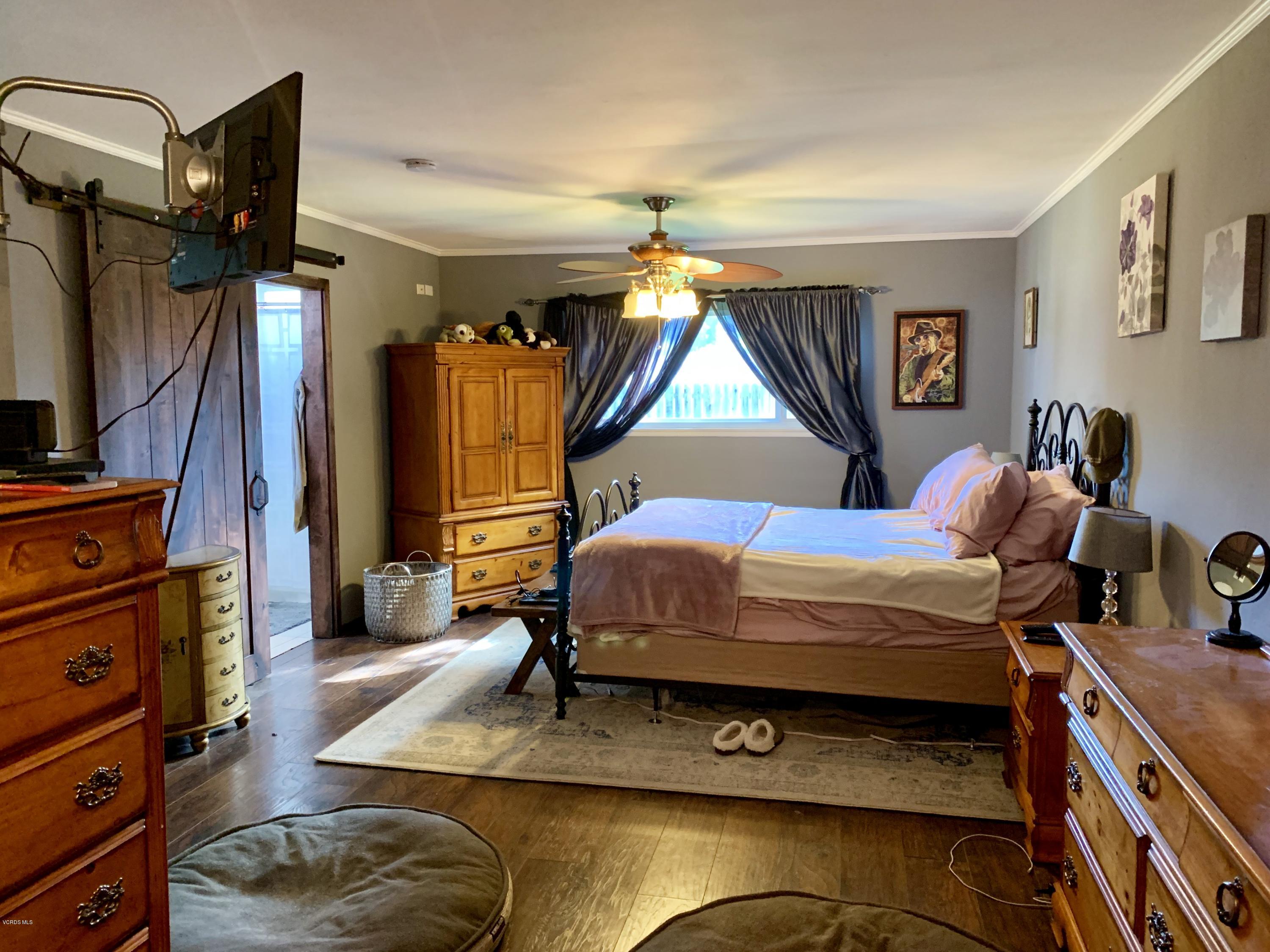 2890 Fitzgerald Road Simi Valley, CA 93065 - Photo 25 of 40 a bedroom with a bed and a dresser