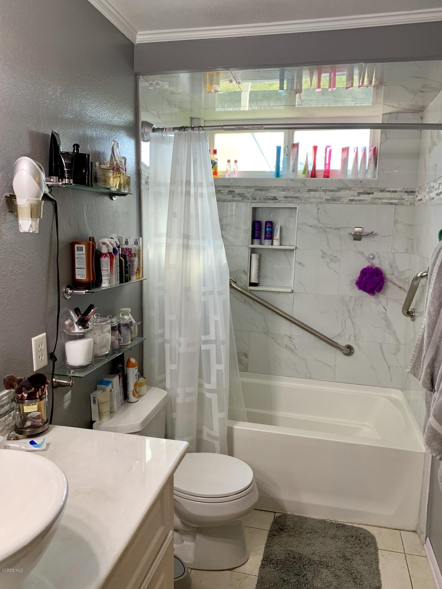 2890 Fitzgerald Road Simi Valley, CA 93065 - Photo 31 of 40 a bathroom with a sink and a toilet
