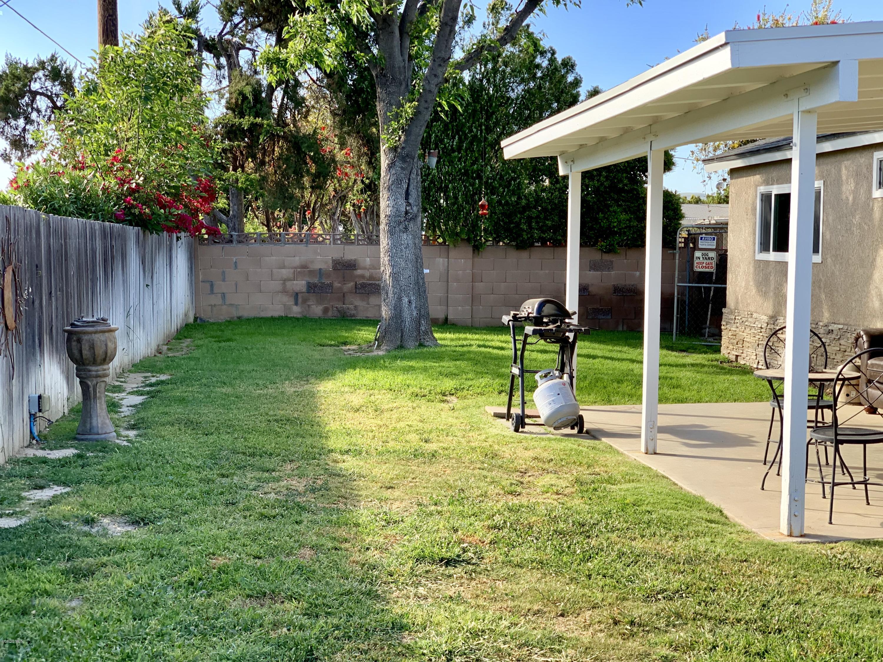 2890 Fitzgerald Road Simi Valley, CA 93065 - Photo 35 of 40 a view of a chair and table in backyard of the house
