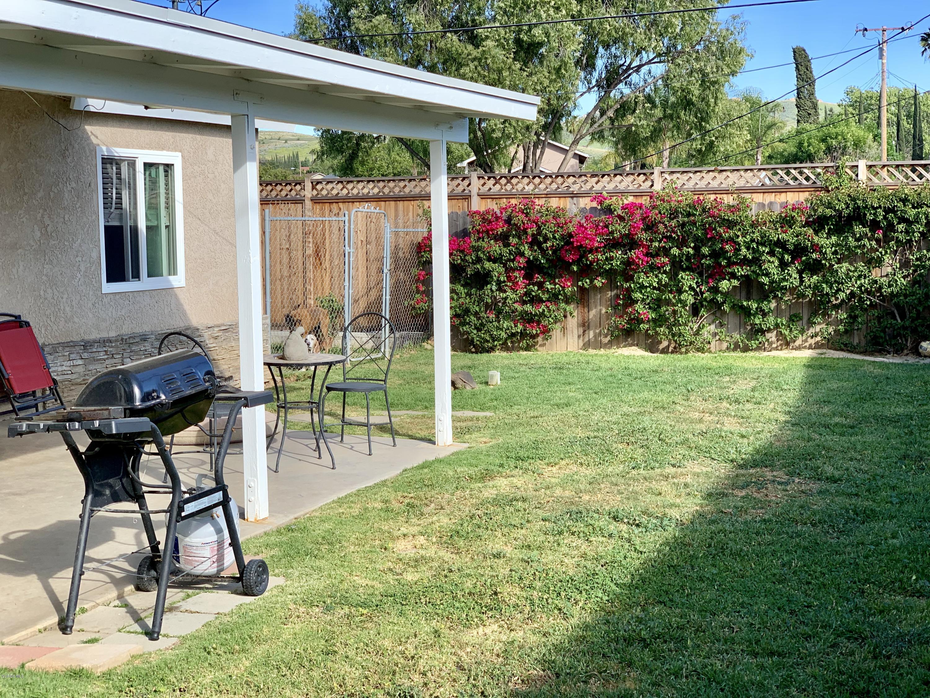 2890 Fitzgerald Road Simi Valley, CA 93065 - Photo 36 of 40 a view of a chair and table in backyard of the house