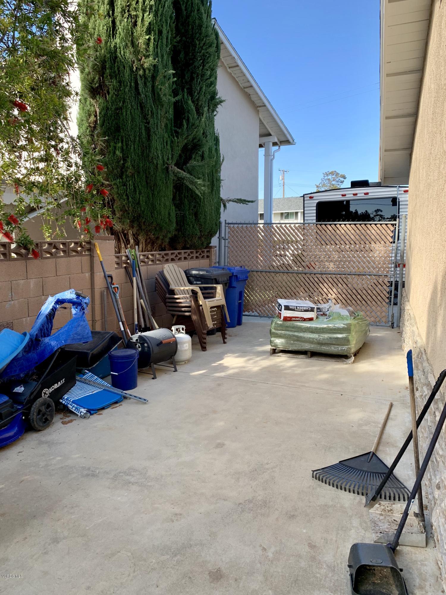 2890 Fitzgerald Road Simi Valley, CA 93065 - Photo 39 of 40 a backyard of a house with barbeque oven table and chairs