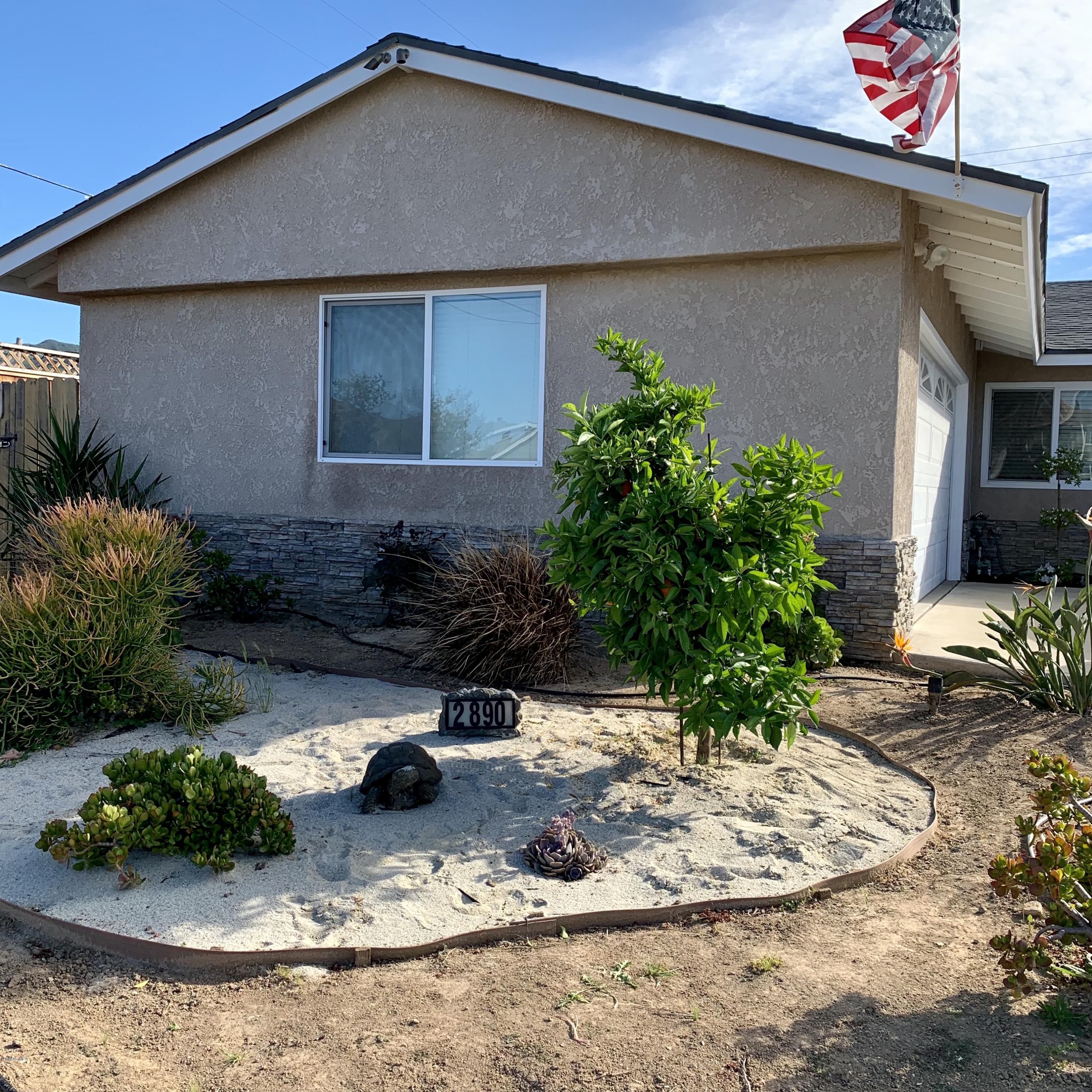 2890 Fitzgerald Road Simi Valley, CA 93065 - Photo 5 of 40 a front view of a house with a yard
