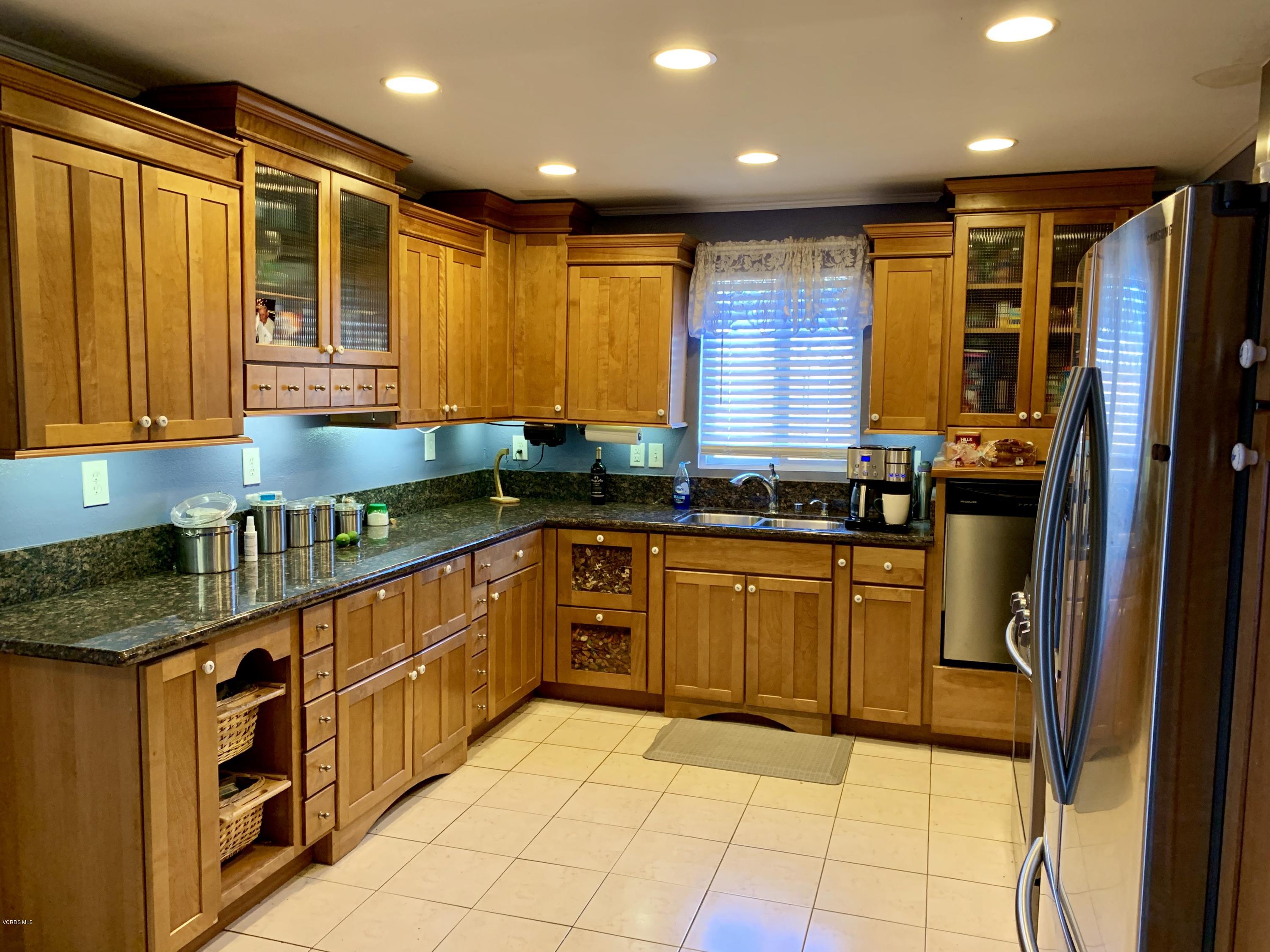 2890 Fitzgerald Road Simi Valley, CA 93065 - Photo 7 of 40 a kitchen with stainless steel appliances granite countertop a stove a sink and a refrigerator