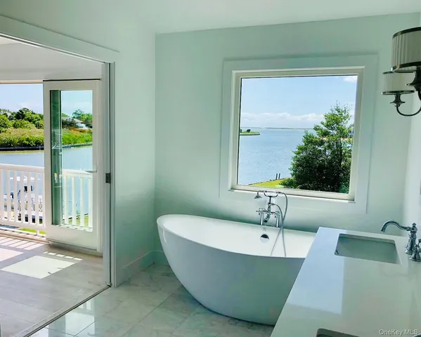 a bathroom with a bathtub and a sink
