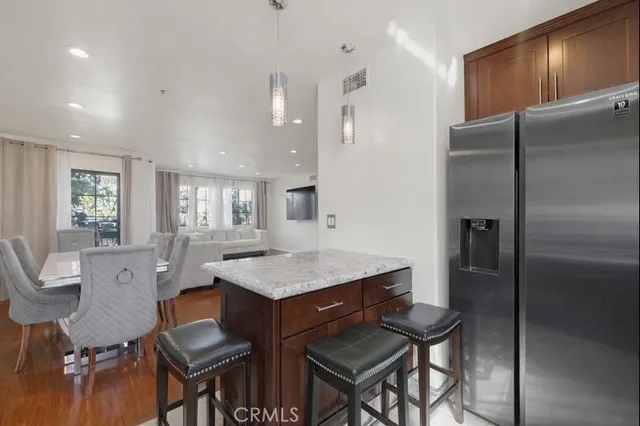 a view of a dining room with furniture wooden floor and chandelier