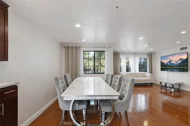 a bedroom with two beds and window