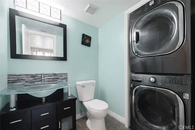 a bathroom with a double vanity sink and mirror